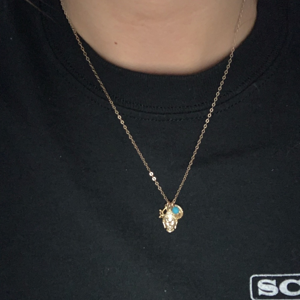 Gold buddha necklace